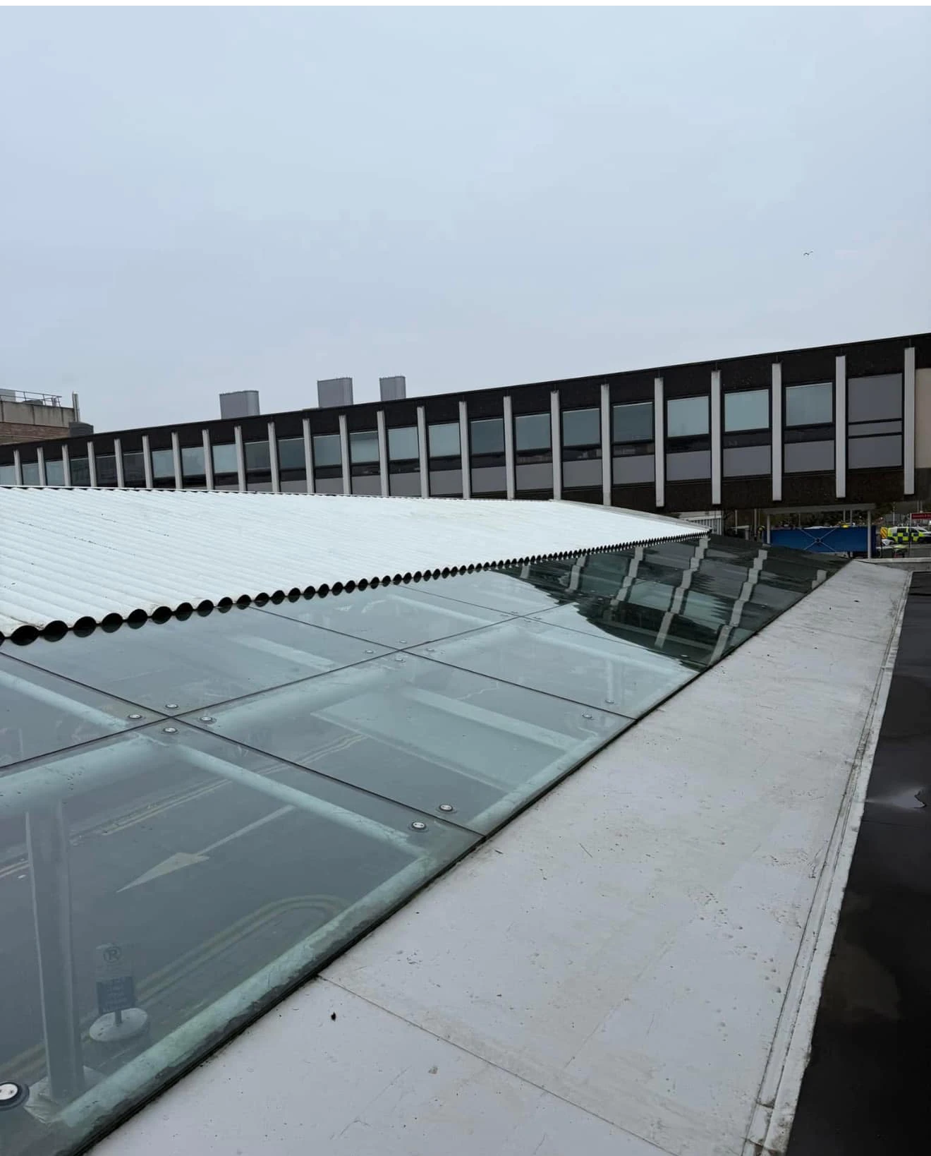 The same glass roof panels clear and reflective after cleaning