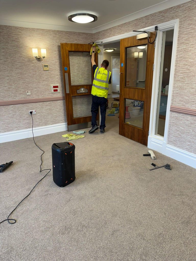 Carpet cleaning equipment in a home hallway